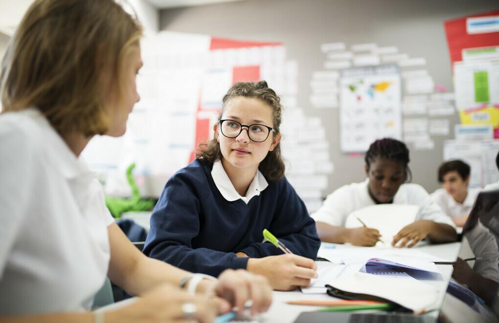 Picture of two students in a classroom