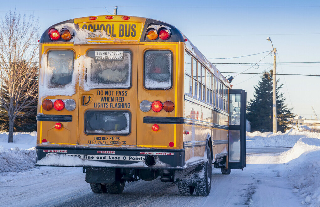 A picture of a school bus in the winter